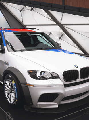 White BMW X3 M performance SUV viewed from front right angle, showing aggressive sport styling with signature kidney grille, muscular hood lines and aerodynamic body kit